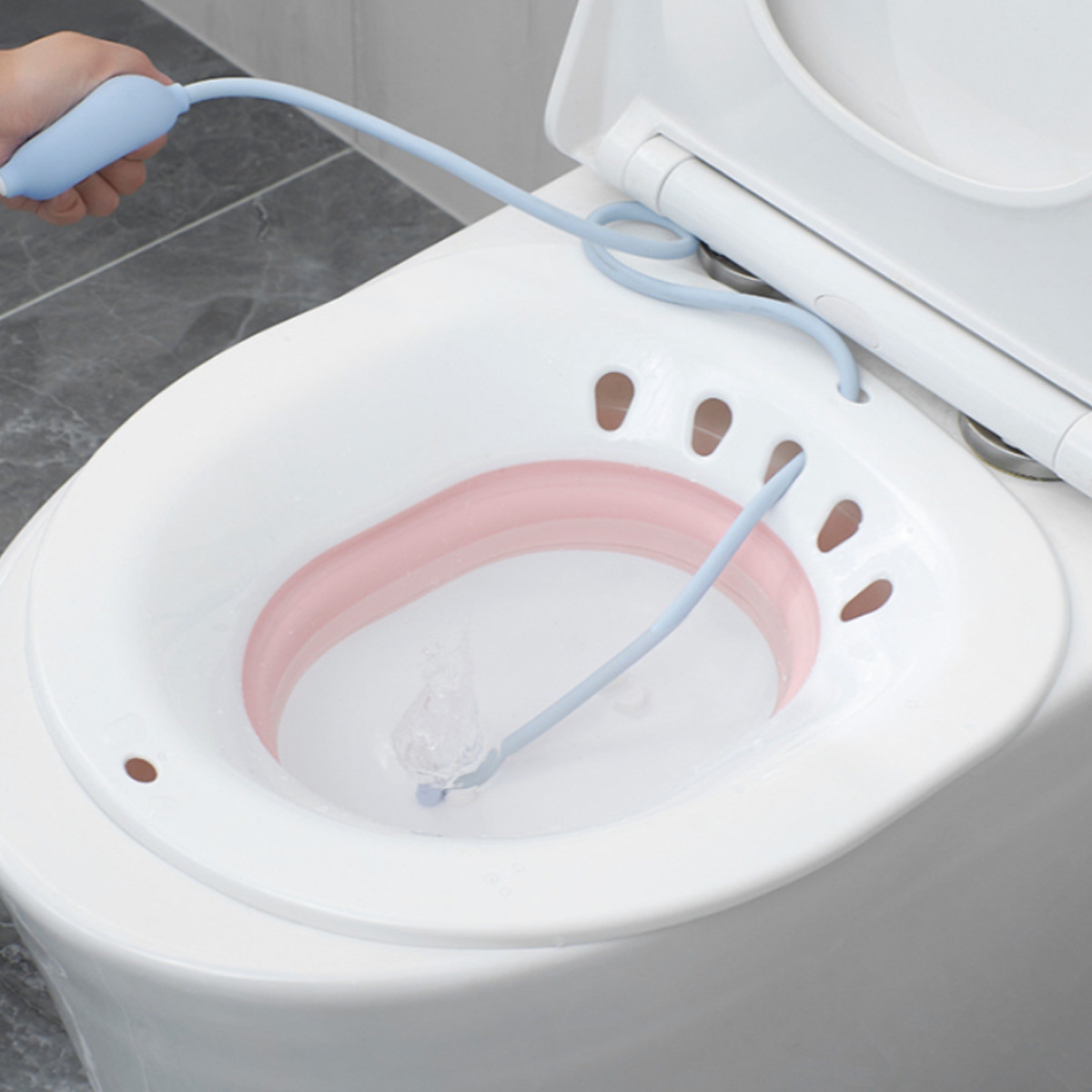 صنفينو حوض العناية بالمنطقة الحساسة بعد الولادة باللون الوردي للأطفال من عمر 0 إلى 2 سنة